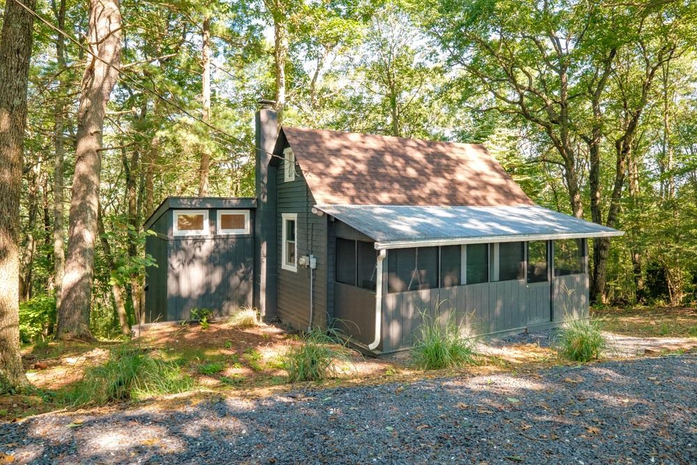 2781 Supinlick Ridge Road Mount Jackson, VA 22842 - Photo 1 of 28 a backyard of a house with yard and outdoor seating
