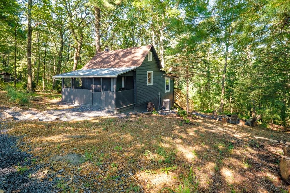 2781 Supinlick Ridge Road Mount Jackson, VA 22842 - Photo 17 of 28 a front view of a house with a garden