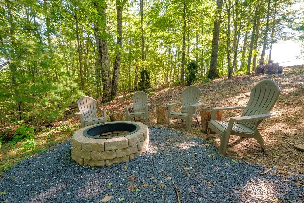2781 Supinlick Ridge Road Mount Jackson, VA 22842 - Photo 21 of 28 a view of a backyard with table and chairs