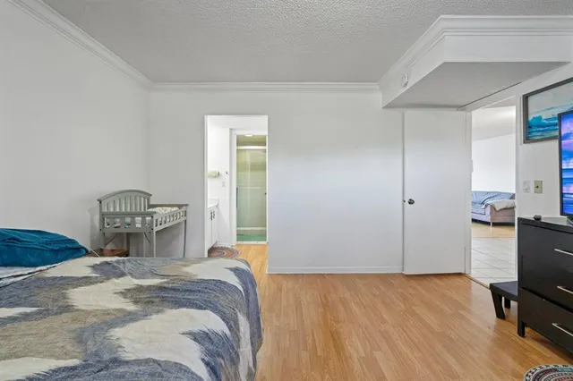 an empty room with a ceiling fan and a window
