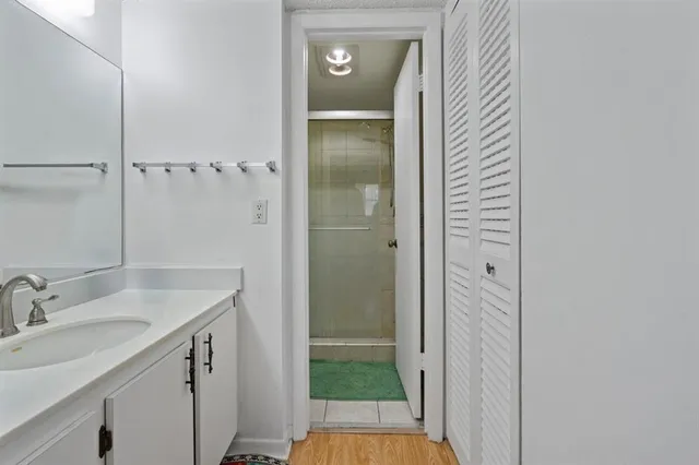 a white toilet sitting next to a bathroom sink