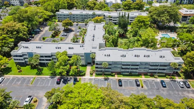 a view of a hallway to rooms and stairs