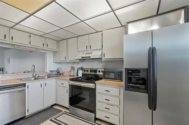 a living room with furniture window and wooden floor