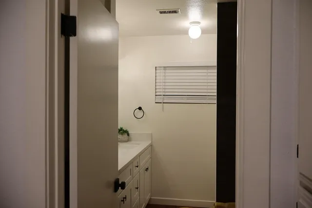 a bathroom with a shower and a mirror