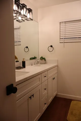 a bathroom with a sink and a mirror