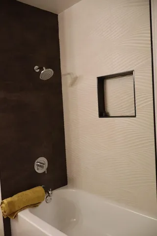 a bathroom with a granite countertop sink