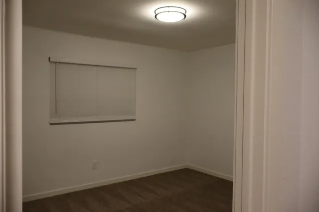 an empty room with fan