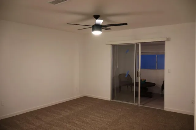a bathroom with double vanity sink and mirror