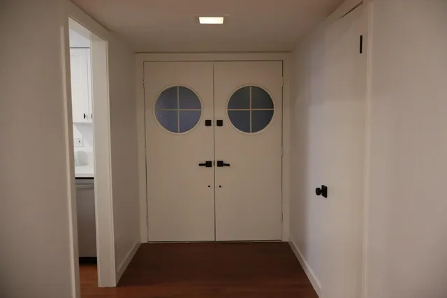 a view of a refrigerator in kitchen and wooden floor