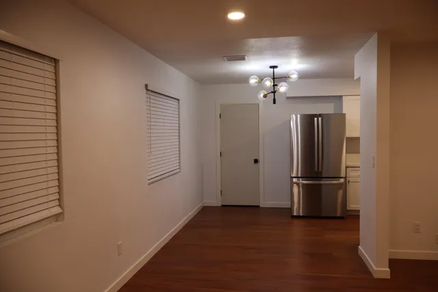 a kitchen with stainless steel appliances a refrigerator and a sink