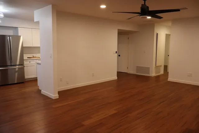 a kitchen with stainless steel appliances a refrigerator and a sink