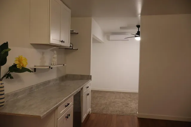 a view of kitchen with cabinets and wooden floor