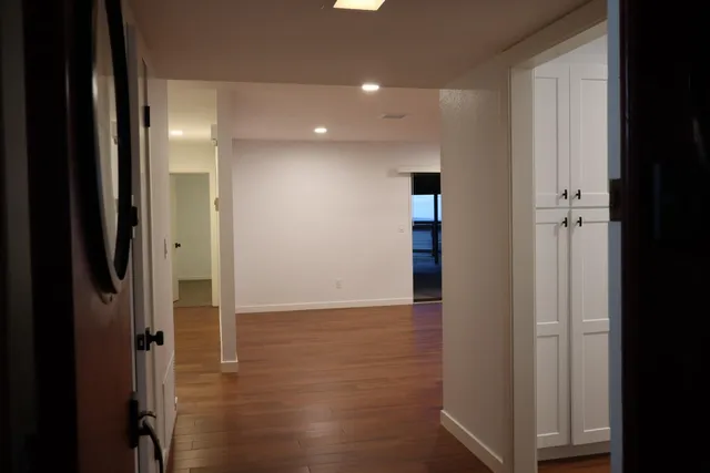 view of hallway with wooden floor