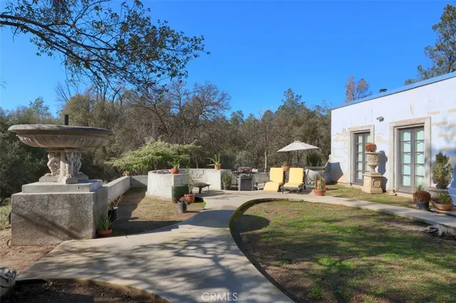 a view of a hallway with potted plants