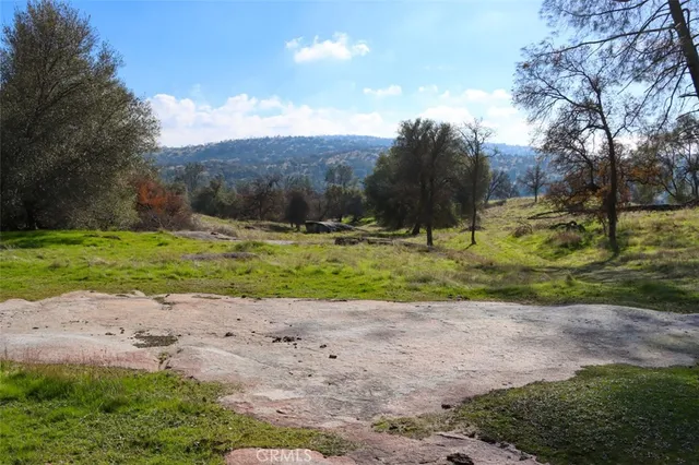a view of a wooden house with a yard