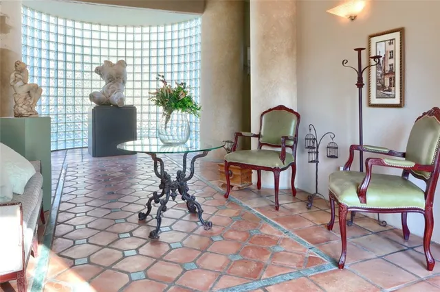 a workspace with furniture and a potted plant