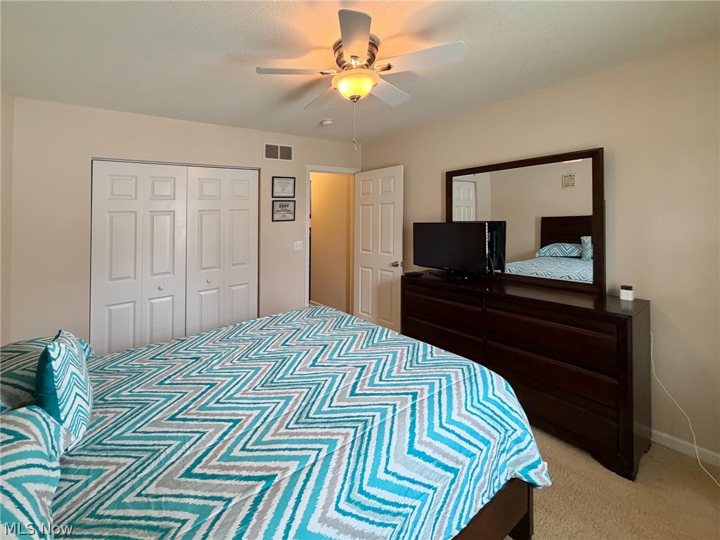 1343 Courtland Road Weirton, WV 26062 - Photo 33 of 50 Bedroom featuring a ceiling fan, light carpet, and a closet