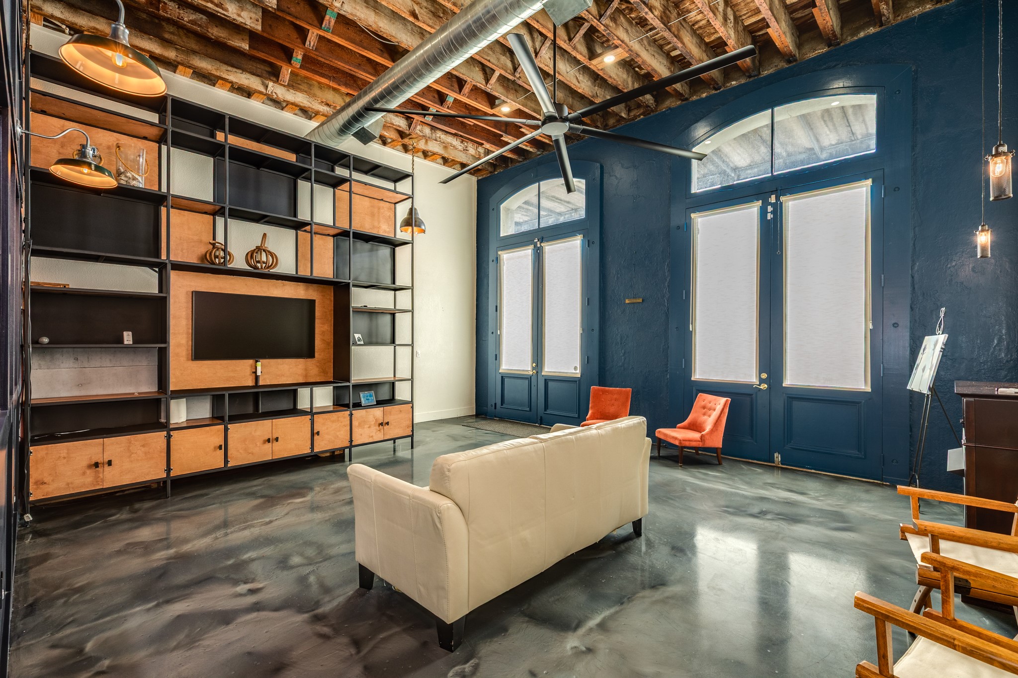 214 Rosenberg Street, Unit 214 Galveston, TX 77550 - Photo 16 of 41 a living room with furniture cabinets and a window