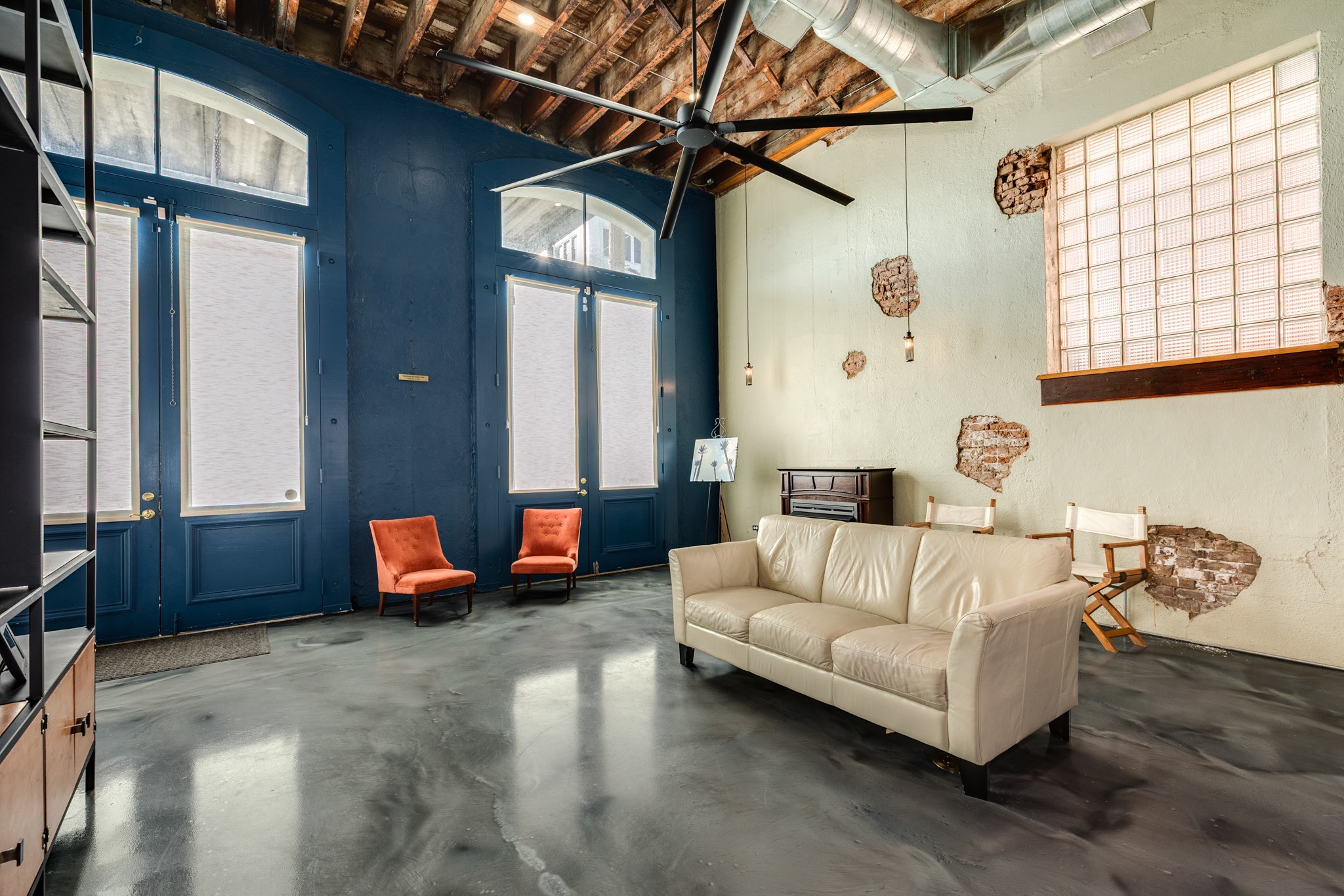 214 Rosenberg Street, Unit 214 Galveston, TX 77550 - Photo 17 of 41 a living room with furniture and a window