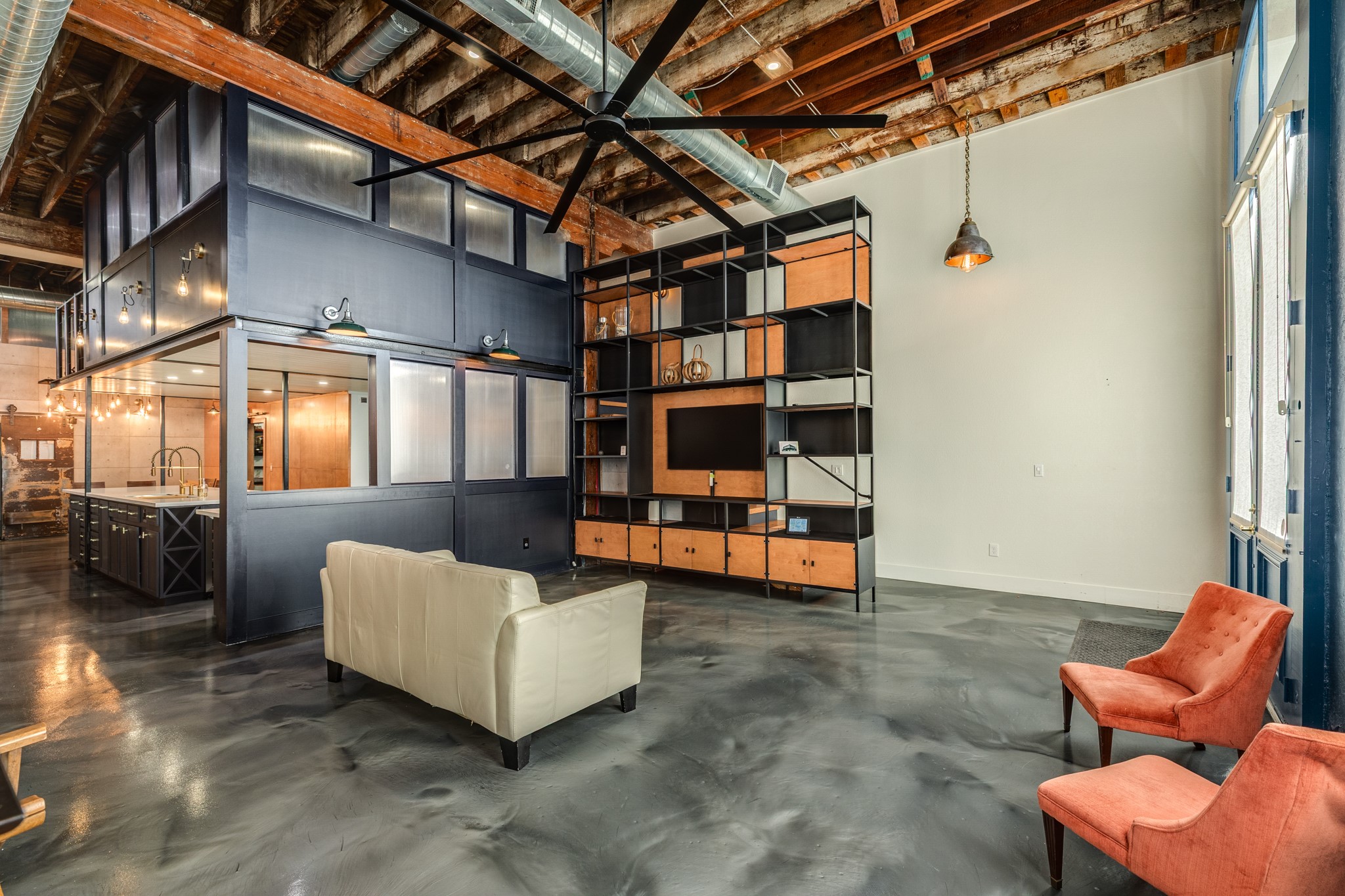 214 Rosenberg Street, Unit 214 Galveston, TX 77550 - Photo 18 of 41 a living room with furniture and a book shelf
