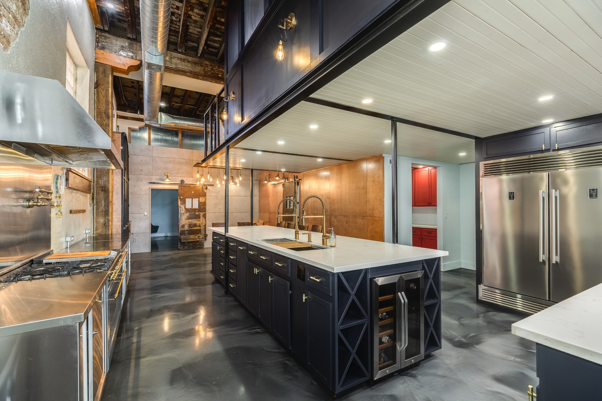 214 Rosenberg Street, Unit 214 Galveston, TX 77550 - Photo 20 of 41 a large kitchen with stainless steel appliances a large counter top