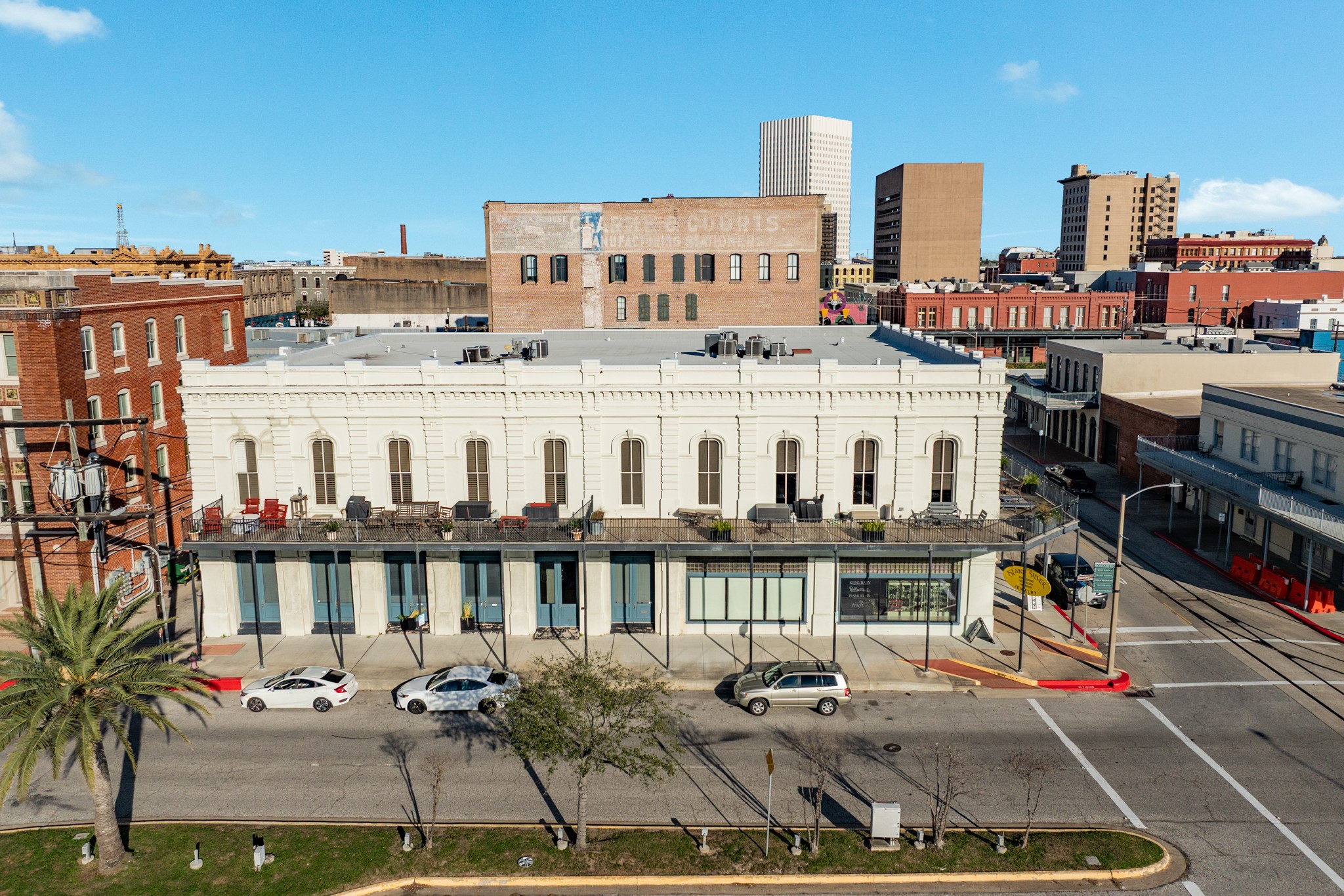 214 Rosenberg Street, Unit 214 Galveston, TX 77550 - Photo 2 of 41 a view of a building with a sitting area