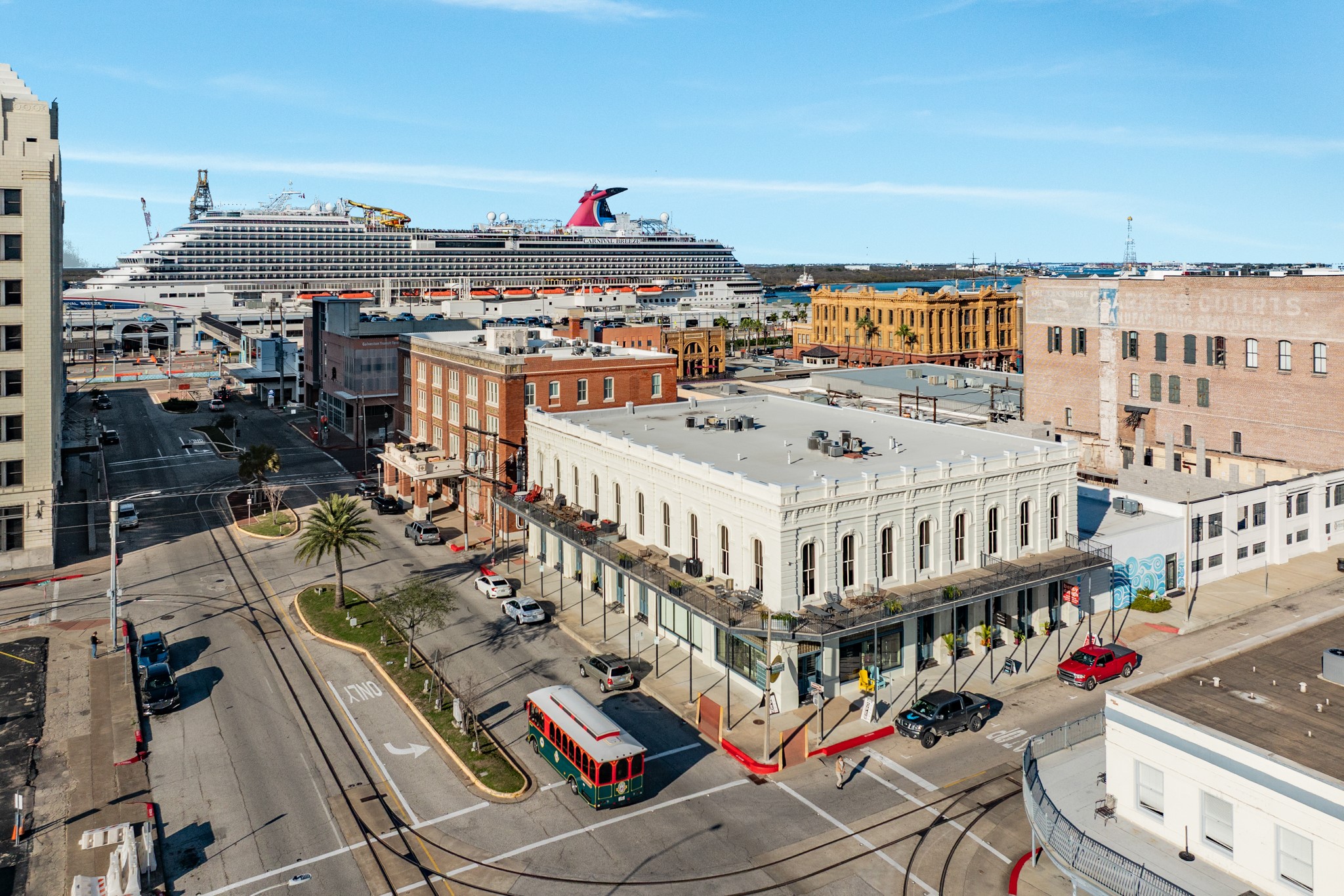 214 Rosenberg Street, Unit 214 Galveston, TX 77550 - Photo 3 of 41 a view of a balcony with wooden floor and city view