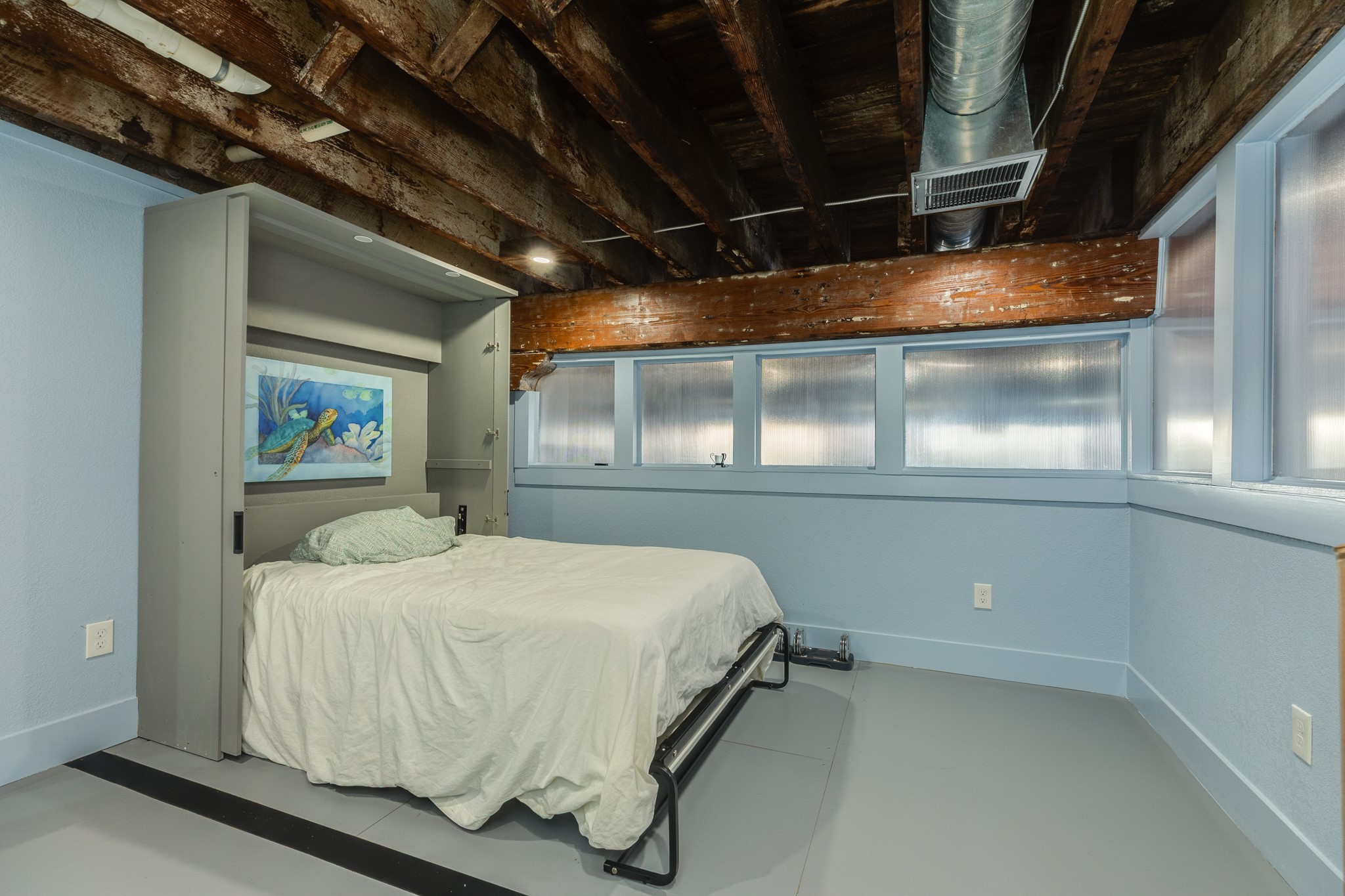 214 Rosenberg Street, Unit 214 Galveston, TX 77550 - Photo 39 of 41 a bedroom with a bed and a window