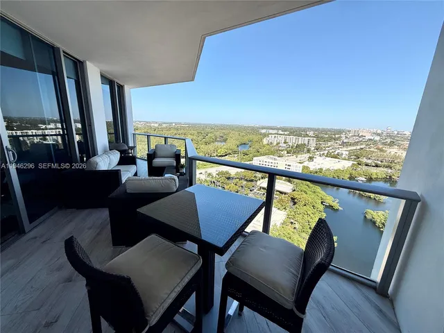 a view of a living room and dining room