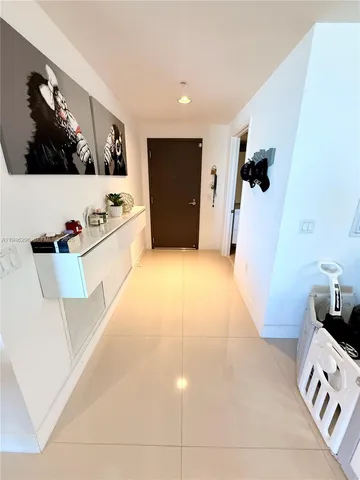 a view of a living room with a flat screen tv