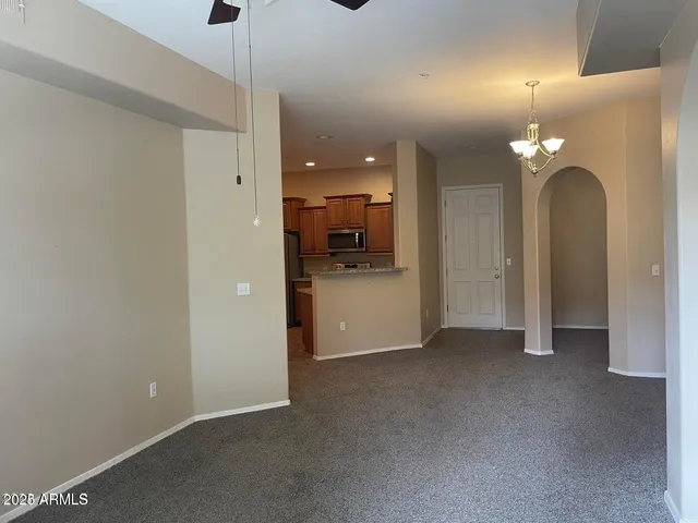 a view of a kitchen with a sink and chandelier fire place