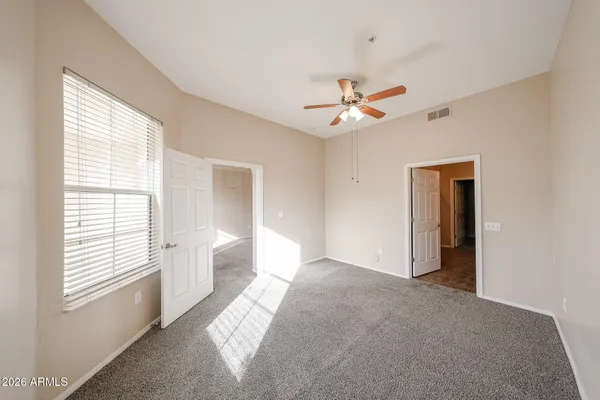 a view of an empty room with a window