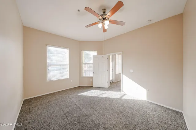 a bathroom with double vanity sink a vanity and a large mirror