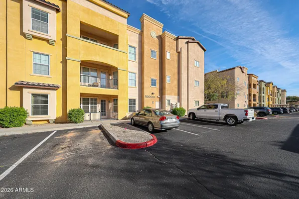 a view of a livingroom with a ceiling fan and window