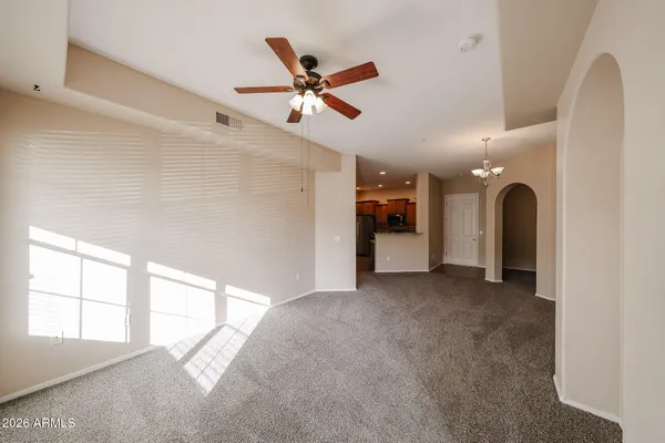 a view of a room with a fireplace and chandelier