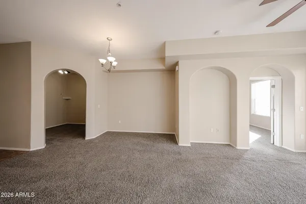 a kitchen with stainless steel appliances granite countertop a refrigerator and a stove