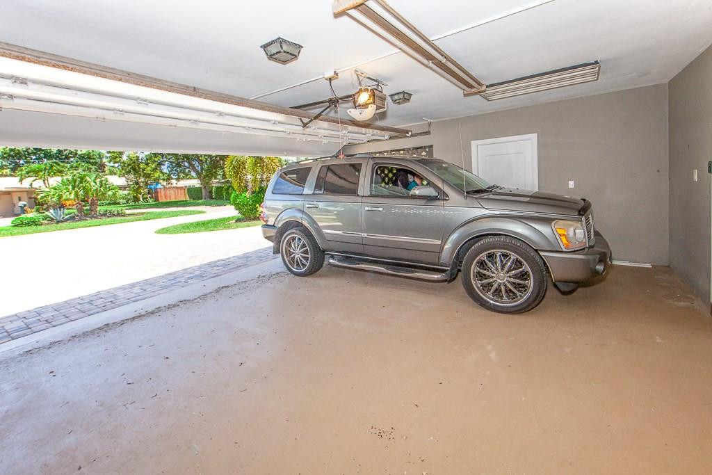 2218 Northeast 31st Street Lighthouse Point, FL 33064 - Photo 23 of 37 @ car garage can take an suv with ease.