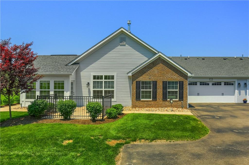 705 Spring Valley Drive Zelienople, PA 16063 - Photo 11 of 34 a front view of a house with a yard and porch