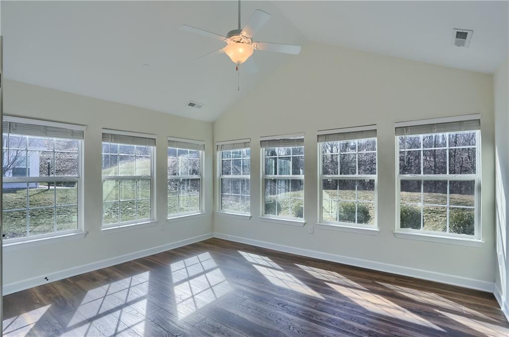 705 Spring Valley Drive Zelienople, PA 16063 - Photo 19 of 34 a view of empty room with wooden floor and fan