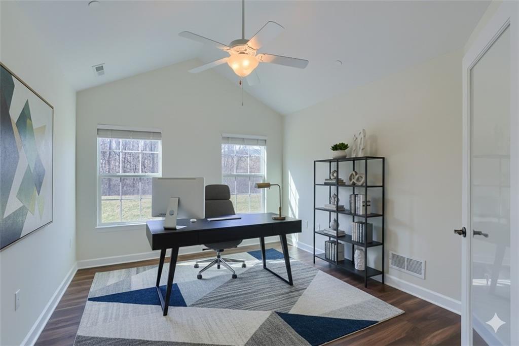 705 Spring Valley Drive Zelienople, PA 16063 - Photo 3 of 34 a view of a workspace with furniture and a window