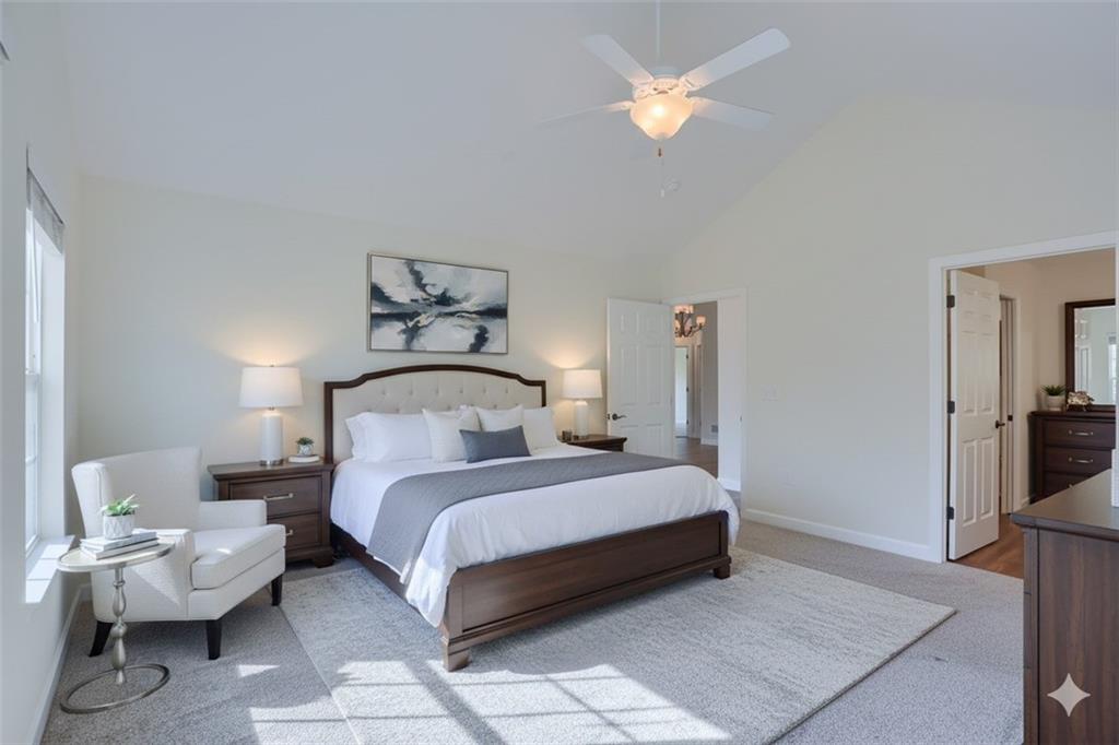 705 Spring Valley Drive Zelienople, PA 16063 - Photo 7 of 34 a bedroom with a bed and a chandelier