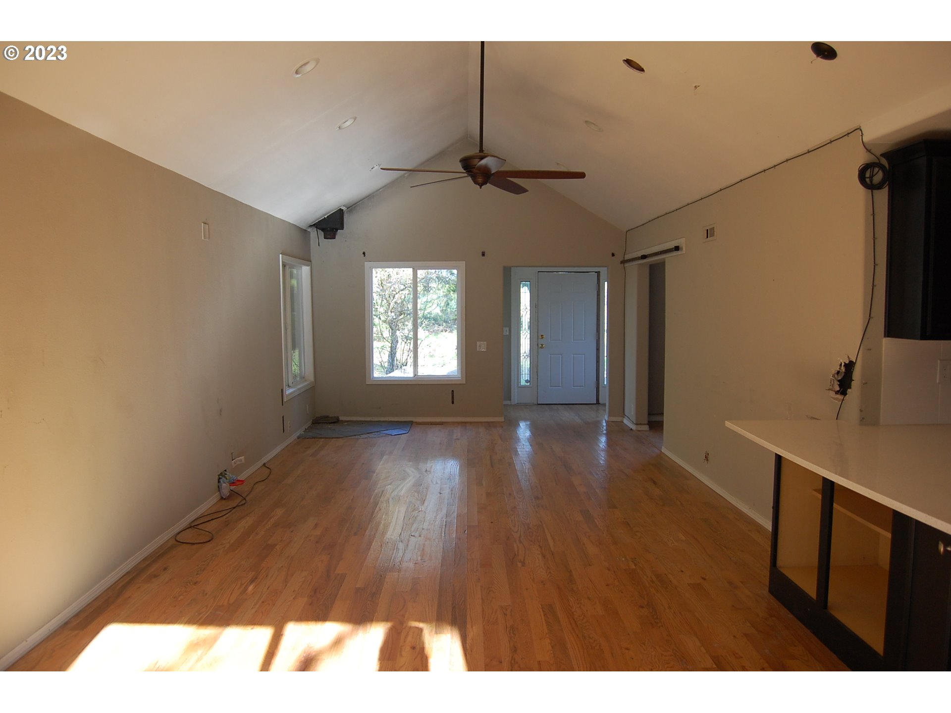 5145 Red Prairie Road Sheridan, OR 97378 - Photo 3 of 43 a view interior of a house wooden floor windows and a chandelier fan