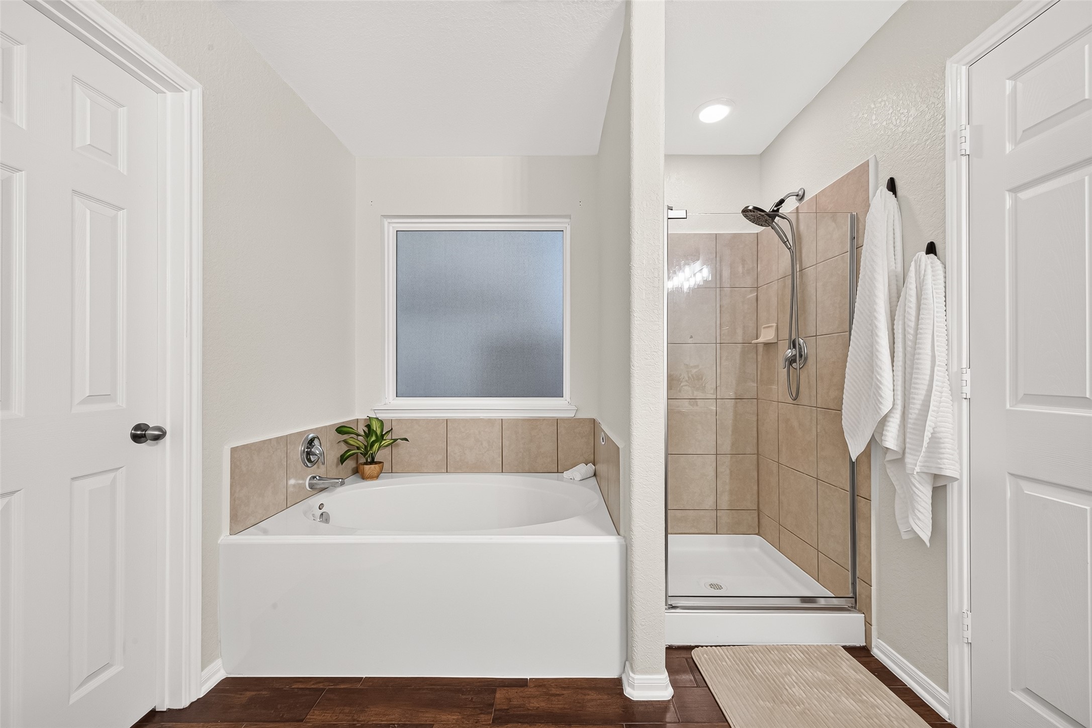 3155 View Valley Trail Katy, TX 77493 - Photo 35 of 50 Spa-like en-suite bath featuring a relaxing soaking tub and a separate, modern walk-in shower.