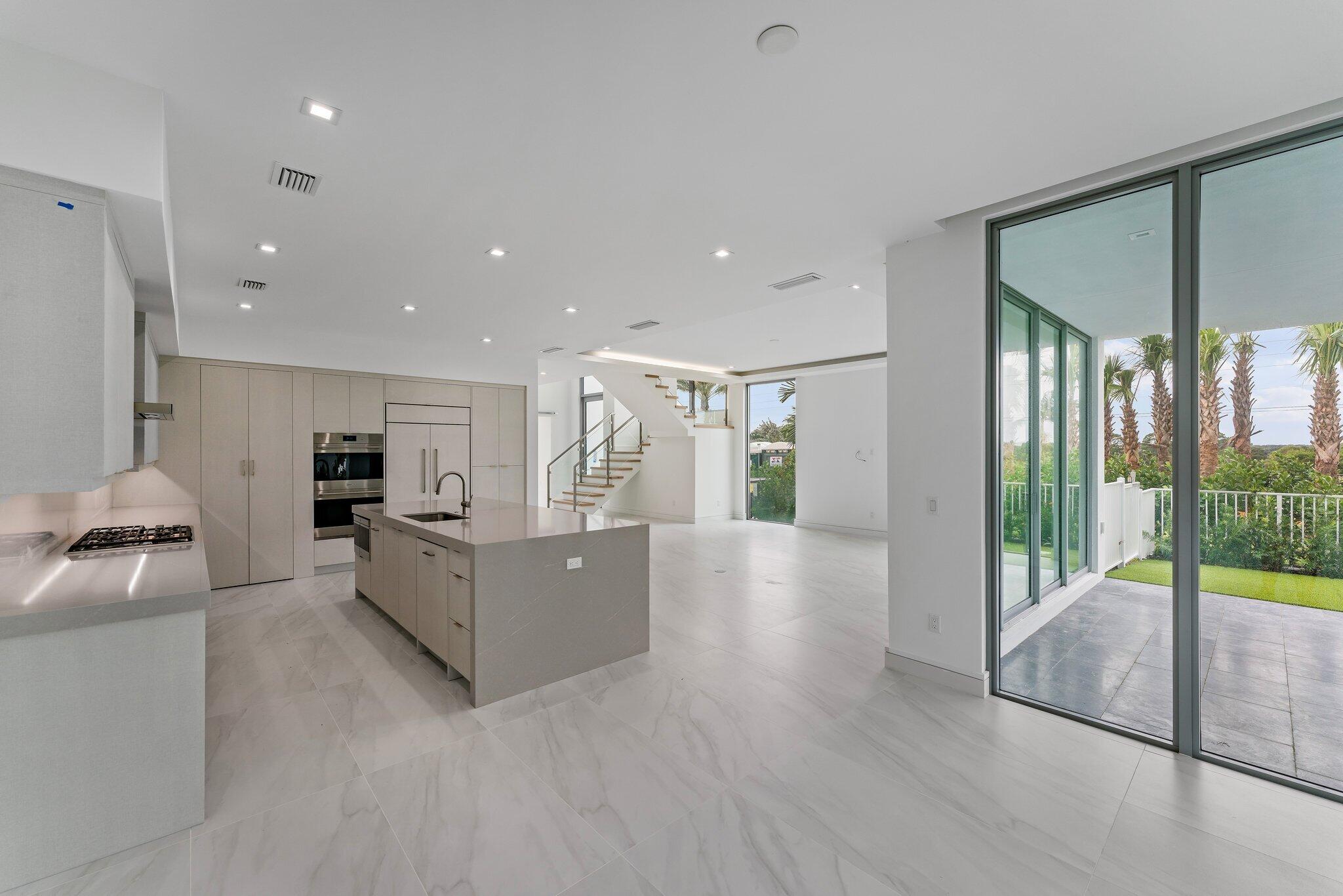 423 Ocean One Lane Juno Beach, FL 33408 - Photo 19 of 58 a large living room with a large window