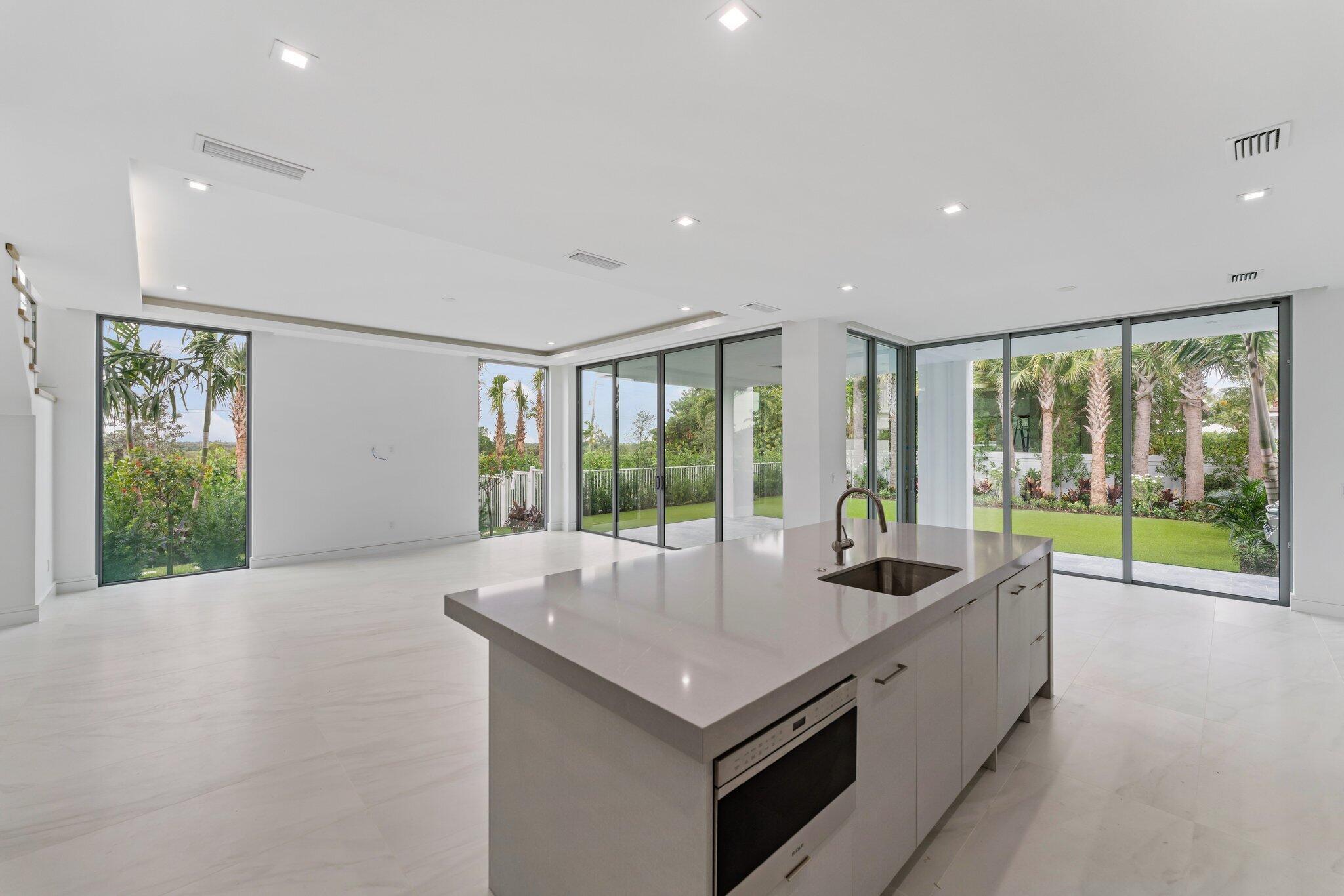 423 Ocean One Lane Juno Beach, FL 33408 - Photo 21 of 58 a kitchen with a sink and large window