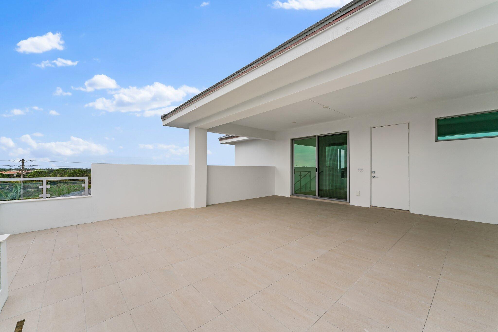 423 Ocean One Lane Juno Beach, FL 33408 - Photo 24 of 58 a view of an empty room with a window