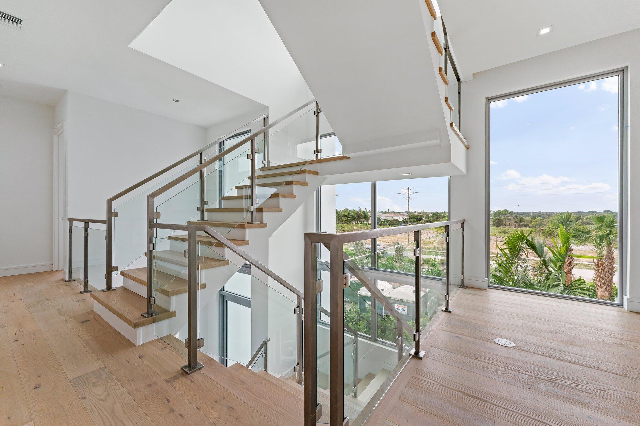 423 Ocean One Lane Juno Beach, FL 33408 - Photo 29 of 58 a view of entryway and hall with wooden floor