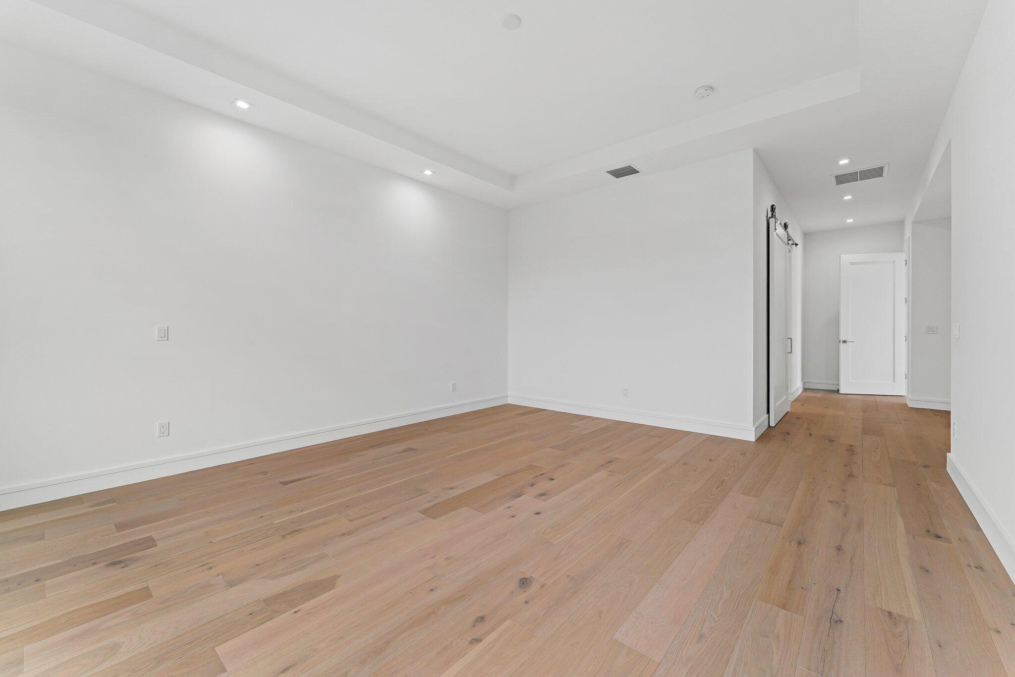 423 Ocean One Lane Juno Beach, FL 33408 - Photo 33 of 58 a view of empty room with wooden floor