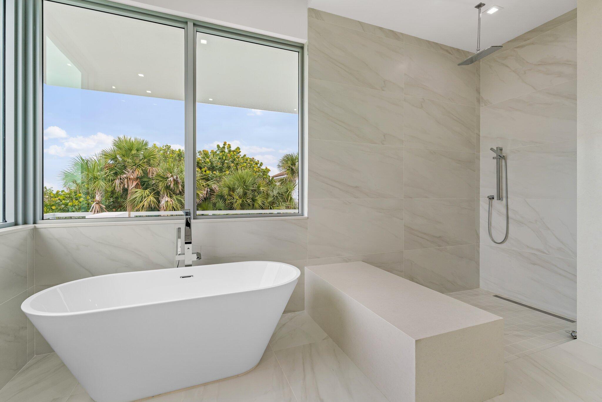 423 Ocean One Lane Juno Beach, FL 33408 - Photo 36 of 58 a bathroom with a bathtub and shower