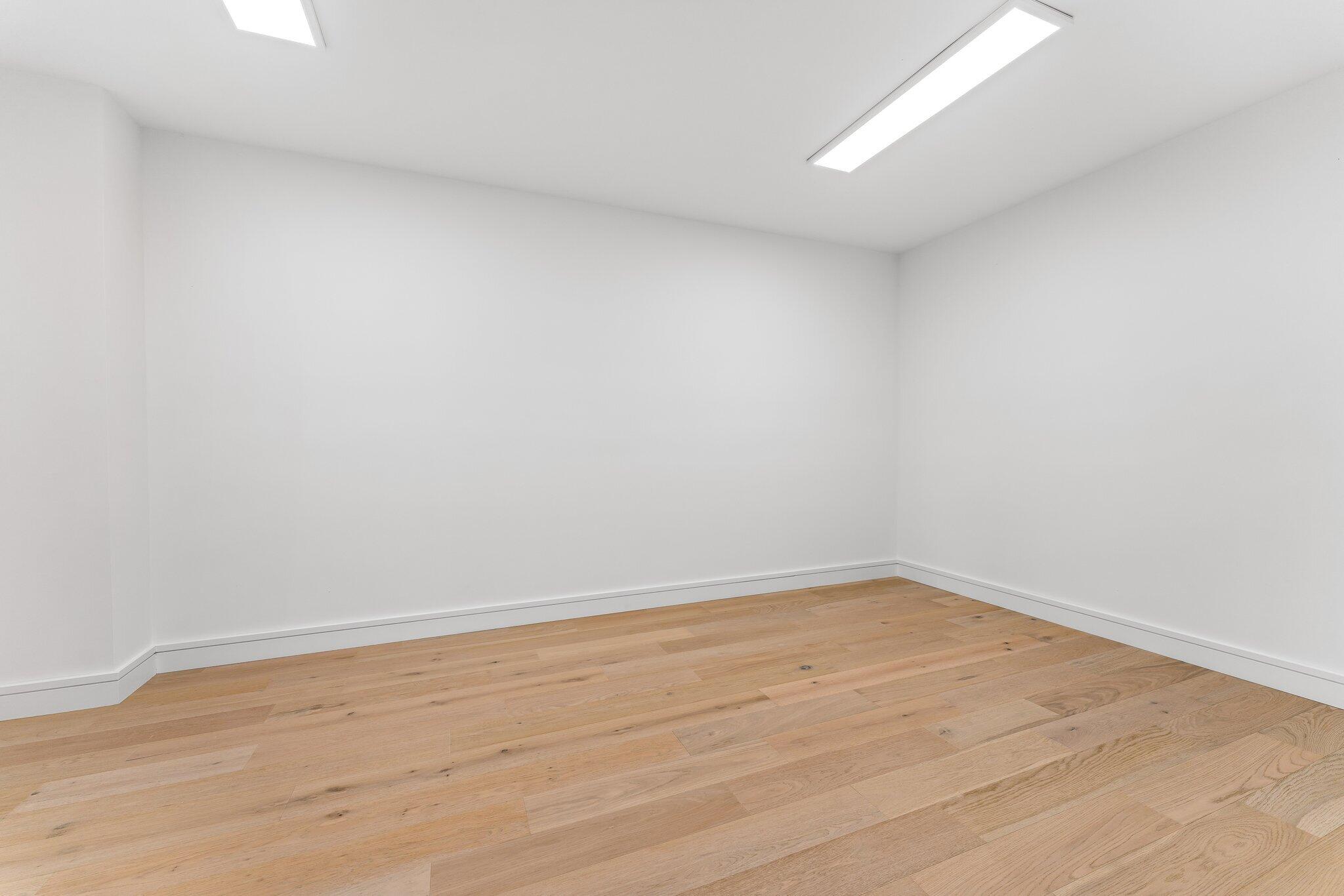 423 Ocean One Lane Juno Beach, FL 33408 - Photo 38 of 58 a view of an empty room with wooden floor